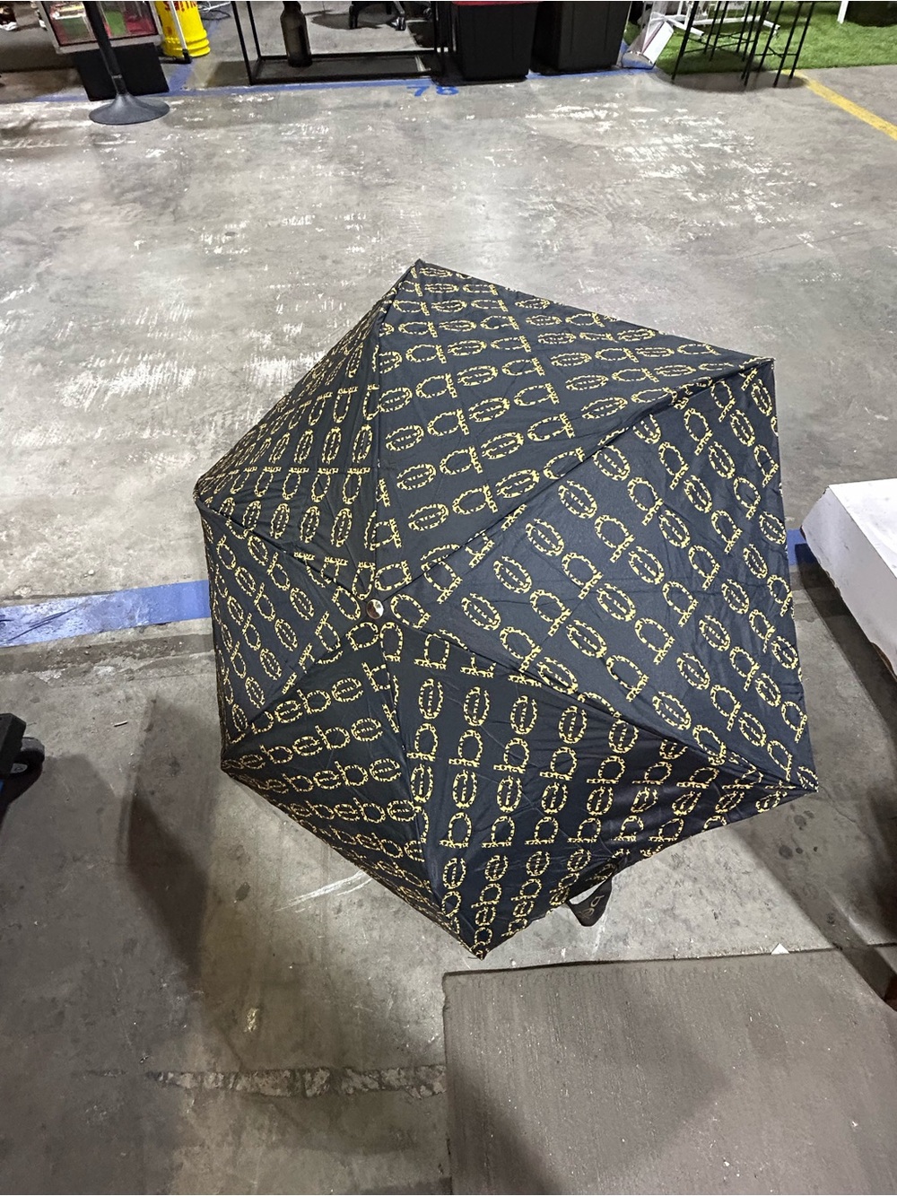 Bebe Black Umbrella with Gold Chain Print. br sh